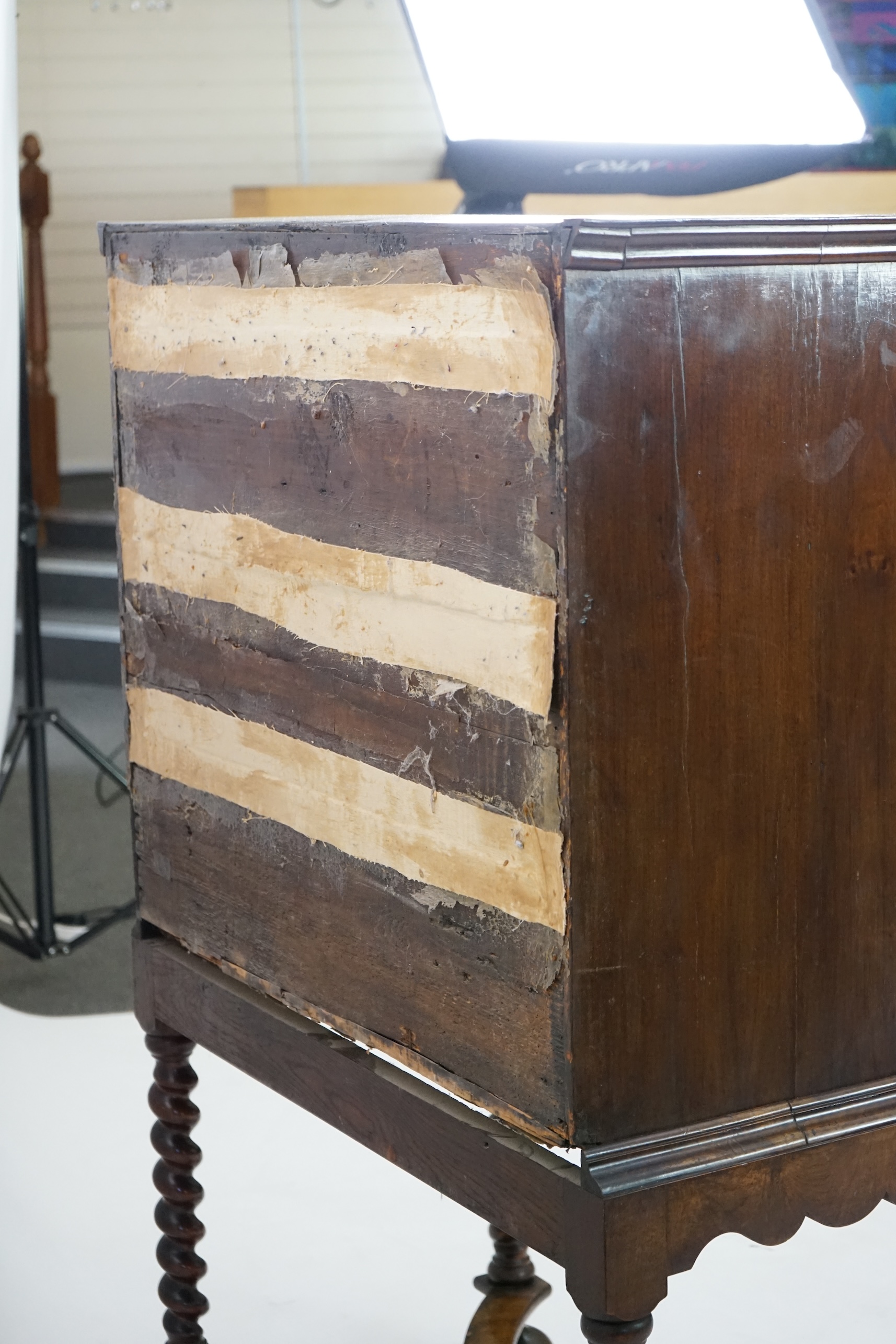 An early 18th century and later crossbanded walnut chest on stand